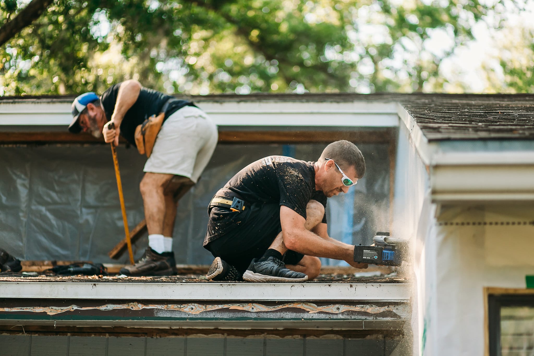 Image of McFall team member re-roofing a home