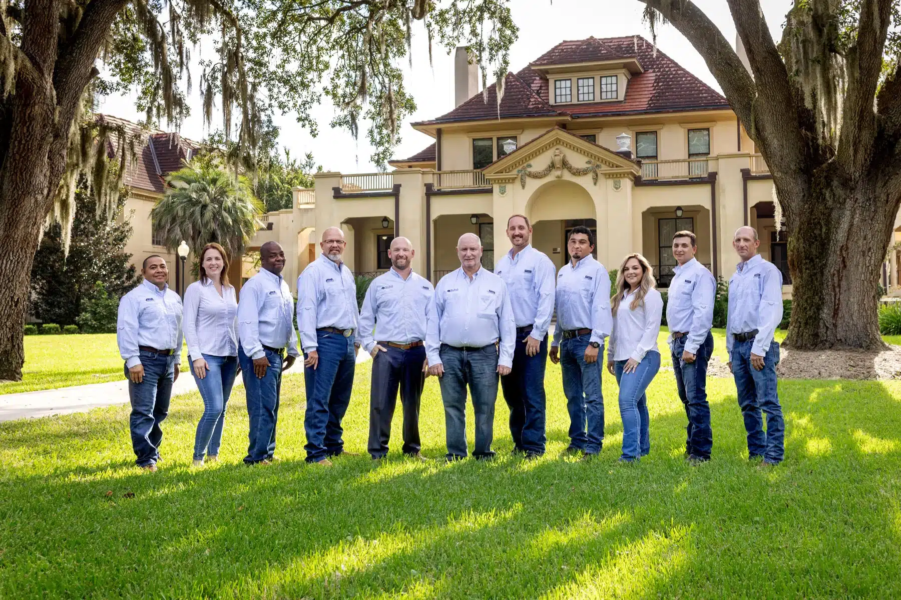 McFall Roofing team photo outside of Gainesville's Thomas Center