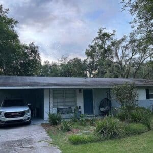 An image of roof damage. A house with roof stains in Gainesville, FL.